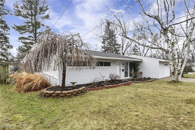 single story home featuring a garage, fence, a front lawn, and concrete driveway