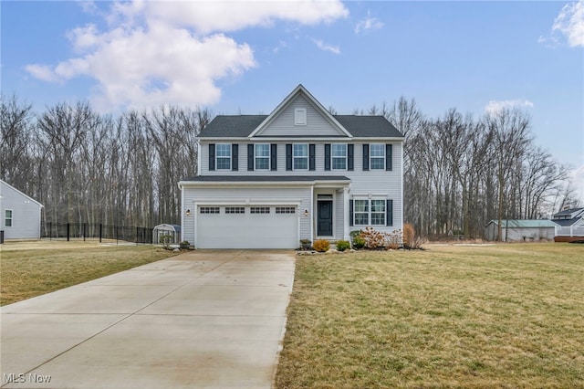 view of front facade featuring a garage, a front yard, and concrete driveway