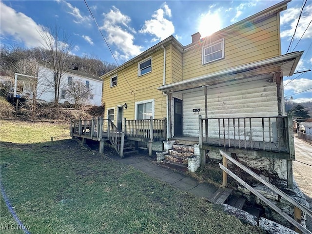546 Rose St, Follansbee, WV 26037 - view of front of house featuring a front lawn and a wooden deck