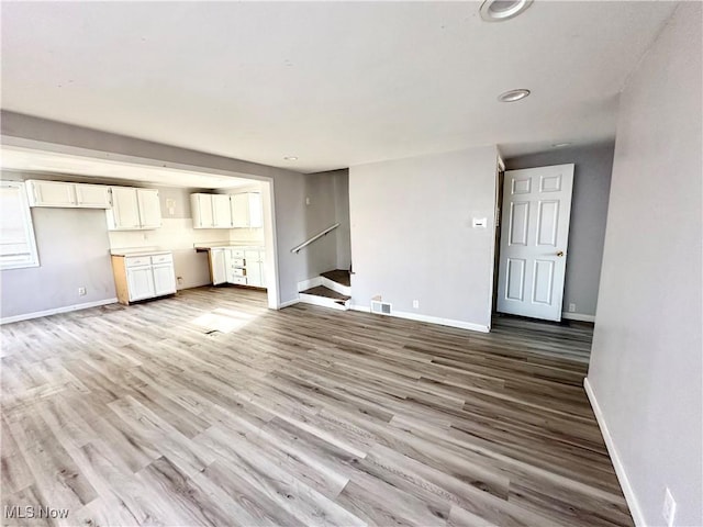 546 Rose St, Follansbee, WV 26037 - unfurnished living room with recessed lighting, visible vents, stairway, wood finished floors, and baseboards
