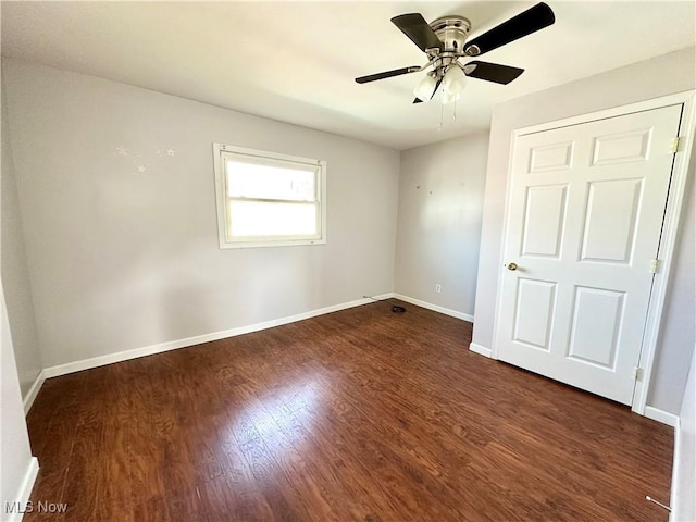 546 Rose St, Follansbee, WV 26037 - spare room with dark wood-style flooring, a ceiling fan, and baseboards