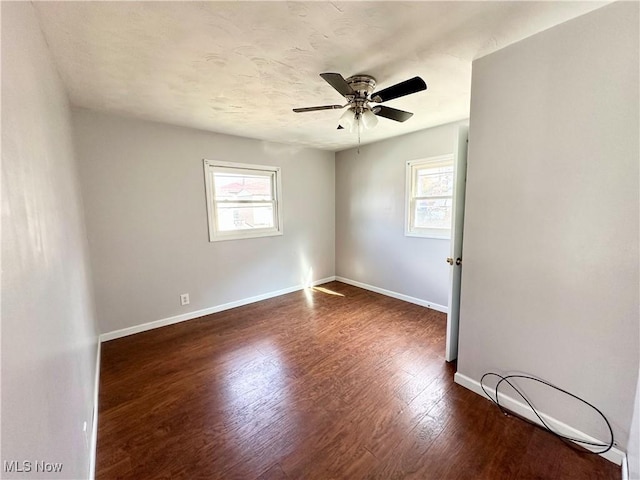 546 Rose St, Follansbee, WV 26037 - empty room with a ceiling fan, baseboards, and dark wood-style flooring