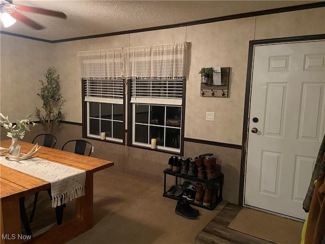 dining space featuring a textured ceiling and a ceiling fan