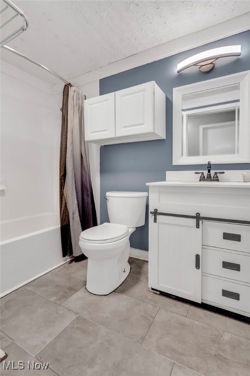 bathroom featuring shower / bath combo, vanity, toilet, and a textured ceiling