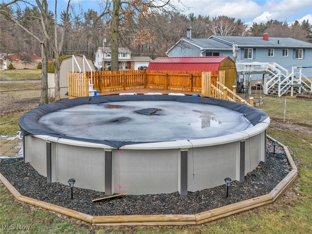 view of swimming pool featuring a fenced backyard