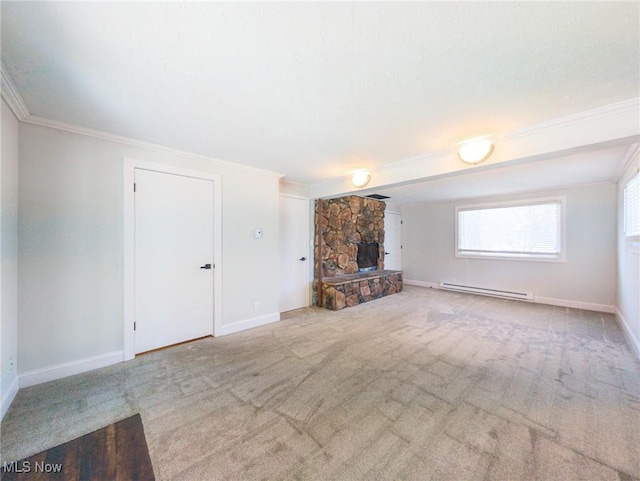 unfurnished living room featuring baseboards, ornamental molding, baseboard heating, carpet floors, and a fireplace