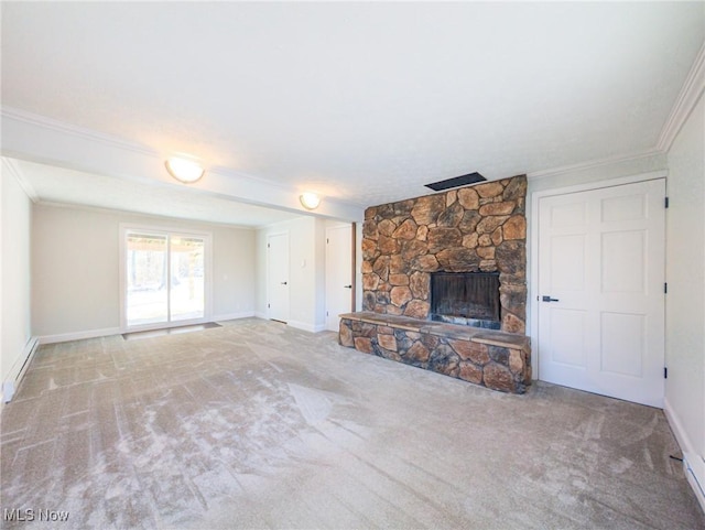 unfurnished living room with a baseboard heating unit, a fireplace, carpet flooring, baseboards, and crown molding