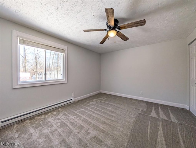 empty room featuring a baseboard heating unit, carpet flooring, a textured ceiling, and baseboards