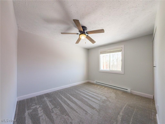 unfurnished room featuring carpet, a textured ceiling, a baseboard heating unit, and baseboards