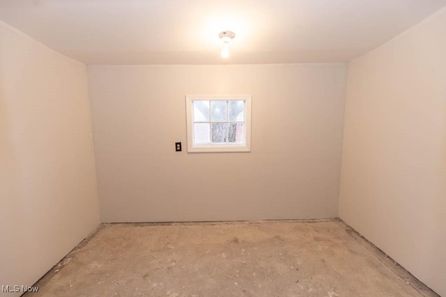 empty room featuring unfinished concrete flooring