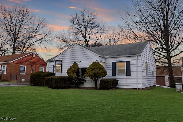 bungalow featuring a yard