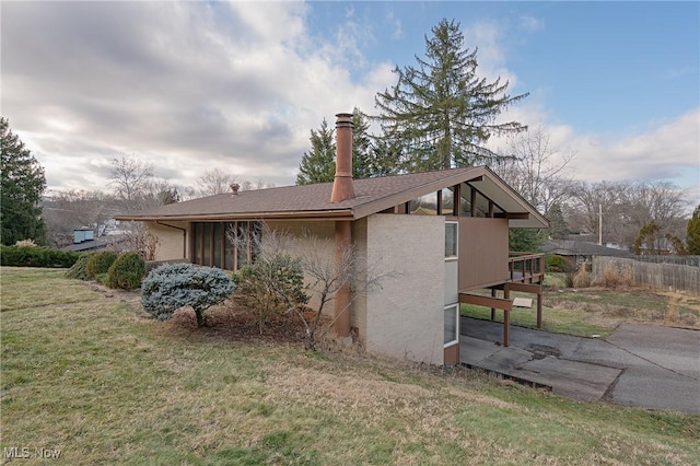 view of home's exterior featuring a yard