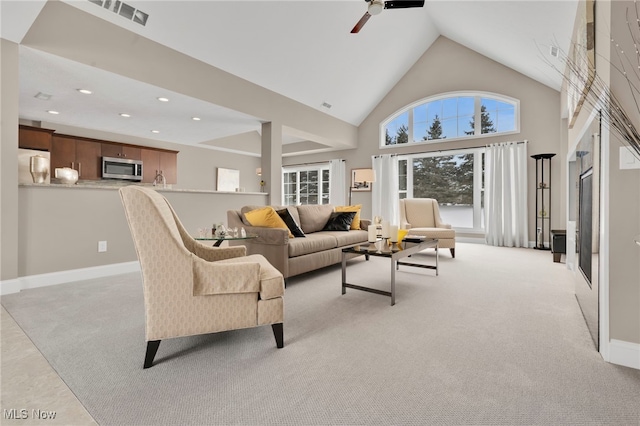 7571 Silverleaf Ct, Sagamore Hills, OH 44067 - living area with light carpet, recessed lighting, high vaulted ceiling, and a ceiling fan