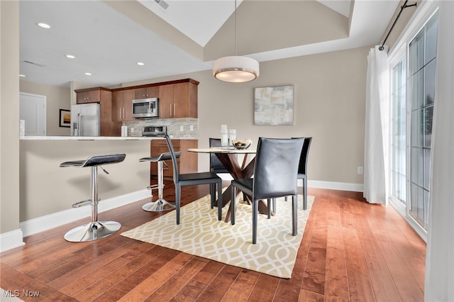 7571 Silverleaf Ct, Sagamore Hills, OH 44067 - dining area with light wood-style floors and recessed lighting