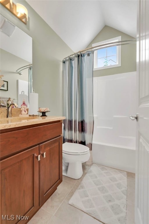7571 Silverleaf Ct, Sagamore Hills, OH 44067 - bathroom featuring lofted ceiling, vanity, shower / bath combo with shower curtain, and tile patterned flooring
