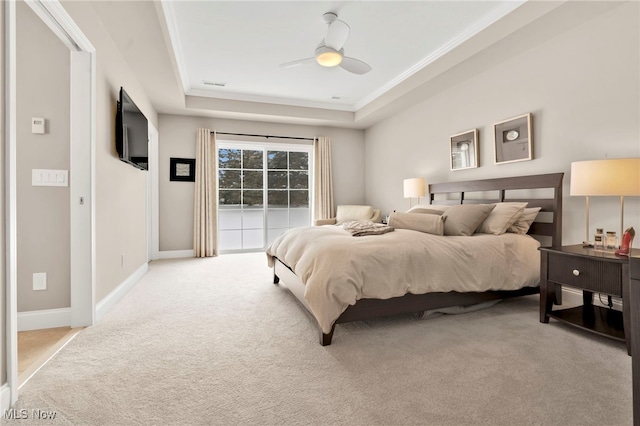 7571 Silverleaf Ct, Sagamore Hills, OH 44067 - bedroom with a raised ceiling, light colored carpet, ceiling fan, ornamental molding, and access to exterior