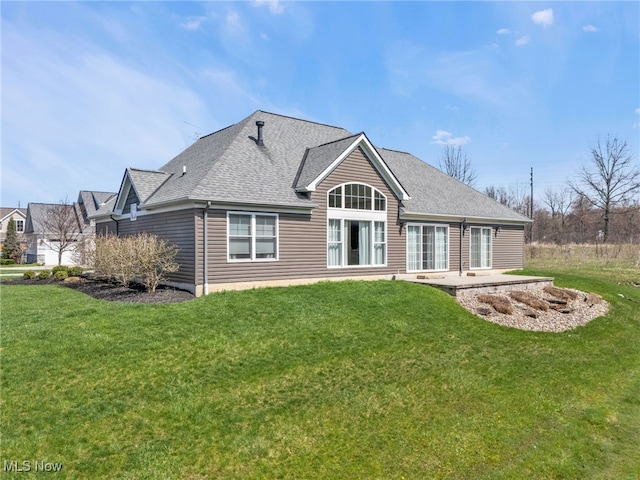 7571 Silverleaf Ct, Sagamore Hills, OH 44067 - back of property featuring a yard, a patio, and roof with shingles