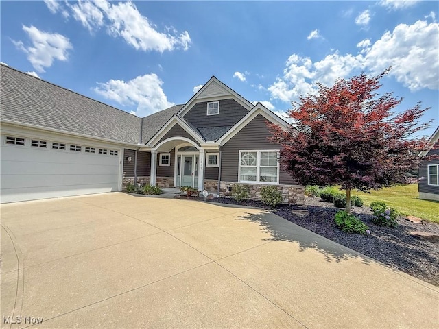 7571 Silverleaf Ct, Sagamore Hills, OH 44067 - view of front of home featuring driveway, a garage, and stone siding