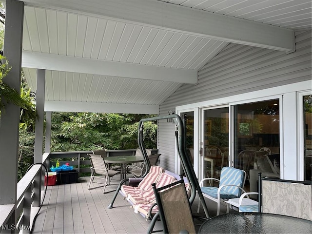 deck featuring outdoor dining area