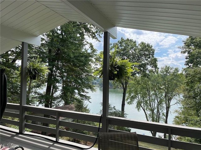 balcony featuring central AC and a water view