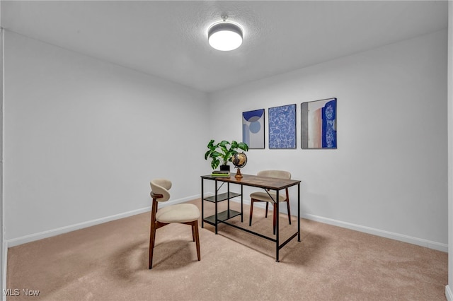 office area featuring carpet and baseboards