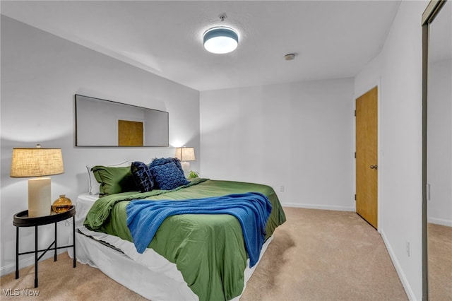 carpeted bedroom with baseboards