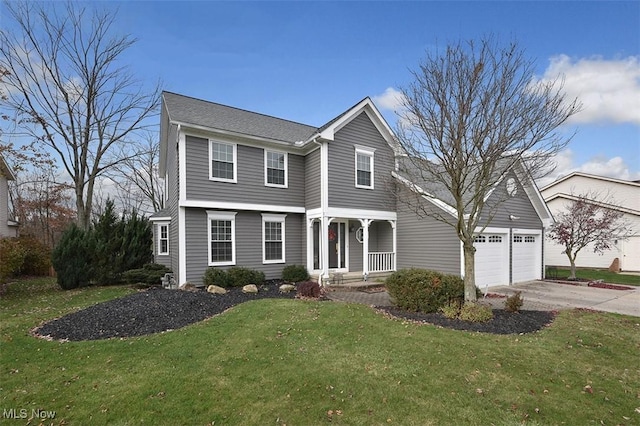 view of front of property featuring a garage, a front lawn, and concrete driveway