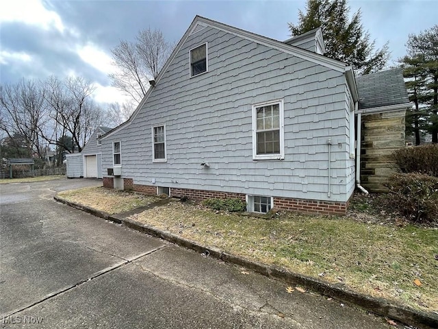 view of side of property with driveway