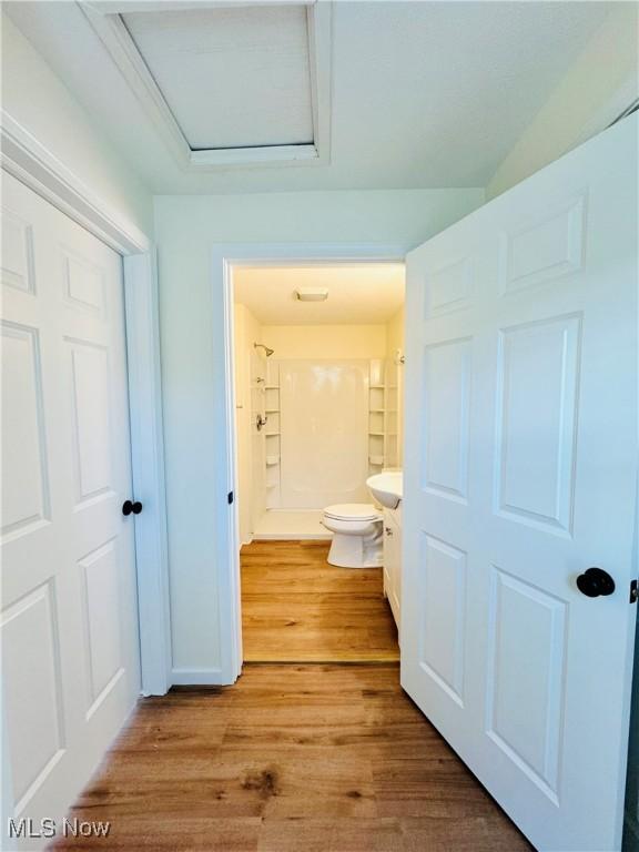 1019 Trenton, Toronto, OH 43964 - bathroom with a shower, vanity, toilet, and wood finished floors