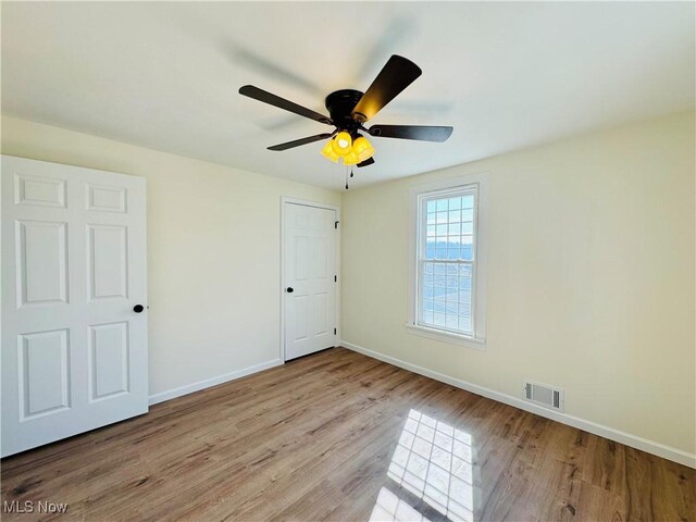 1019 Trenton, Toronto, OH 43964 - unfurnished bedroom featuring a ceiling fan, visible vents, baseboards, and wood finished floors