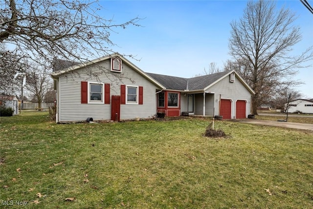 view of front facade with concrete driveway, an attached garage, and a front lawn