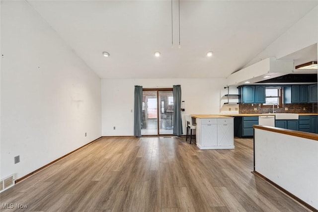 kitchen featuring light countertops, plenty of natural light, and blue cabinets