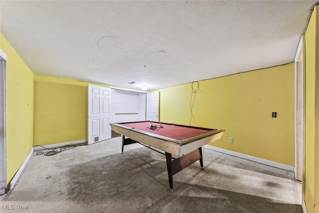 recreation room with concrete floors, billiards, and baseboards