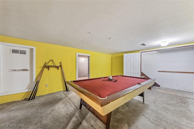 game room featuring concrete floors, visible vents, a textured ceiling, and pool table