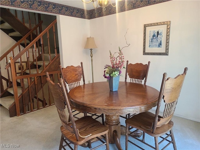 dining area featuring stairway, carpet flooring, and baseboards