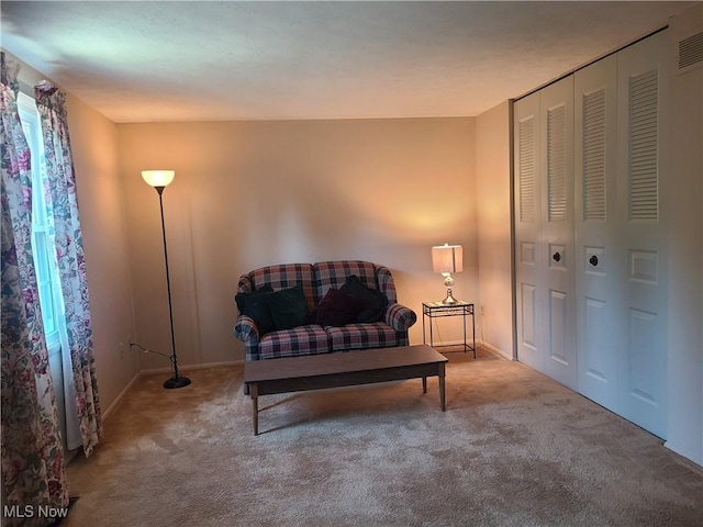 living area with carpet floors and baseboards