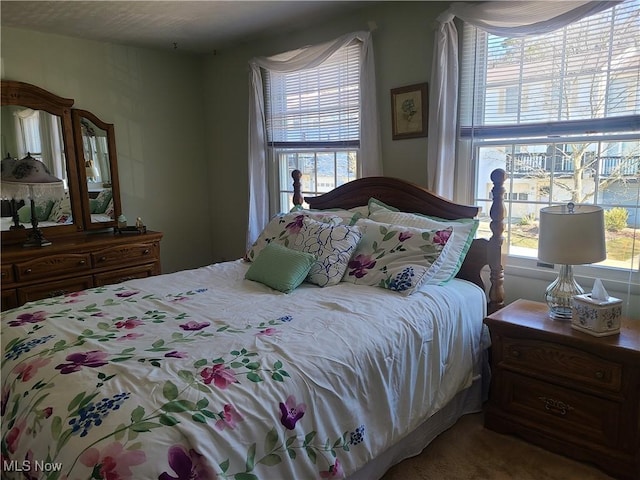 bedroom with multiple windows