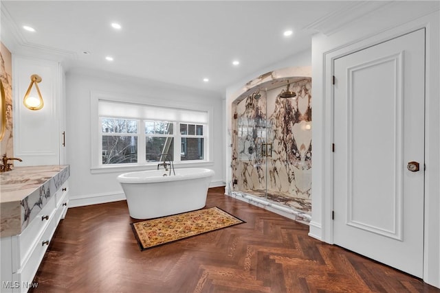 full bathroom with vanity, baseboards, a stall shower, recessed lighting, and a freestanding bath