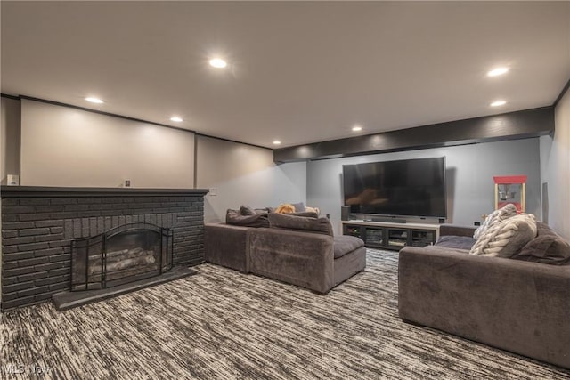 carpeted living area featuring recessed lighting and a fireplace