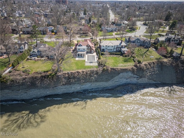 bird's eye view with a residential view and a water view