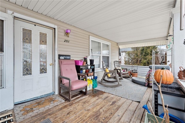 wooden terrace with a porch