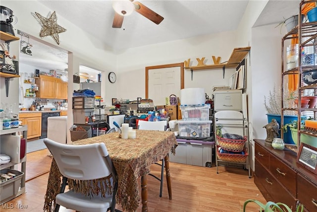 dining area featuring light wood finished floors and a ceiling fan