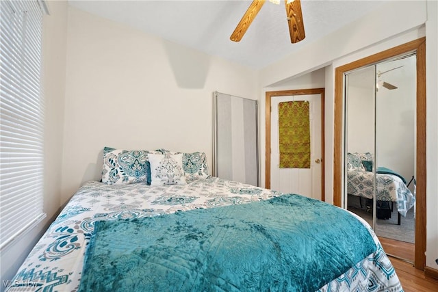 bedroom featuring a ceiling fan and wood finished floors