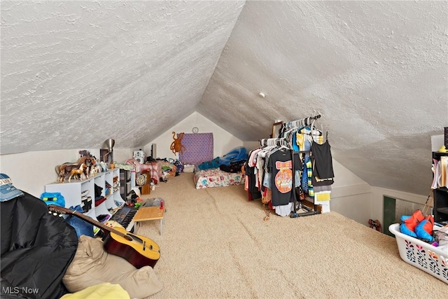 interior space featuring carpet floors, vaulted ceiling, and a textured ceiling