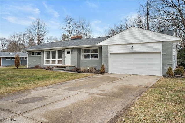 single story home with an attached garage, a front yard, a chimney, and brick siding