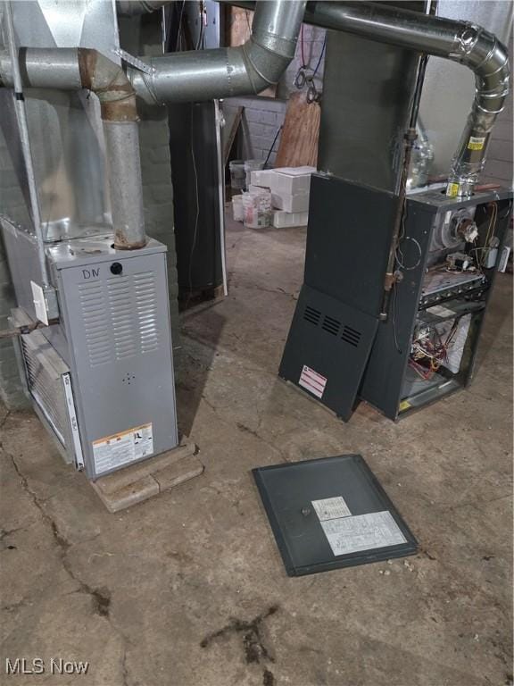 utility room featuring heating unit