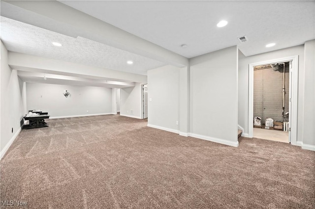 finished basement with recessed lighting, carpet flooring, visible vents, and baseboards