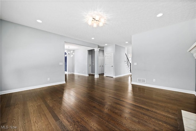 unfurnished living room featuring recessed lighting, wood finished floors, visible vents, and baseboards