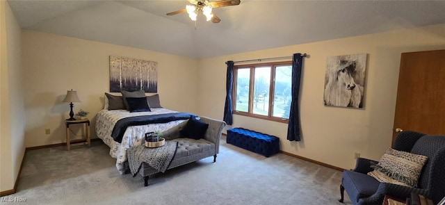 carpeted bedroom featuring lofted ceiling, baseboards, and a ceiling fan