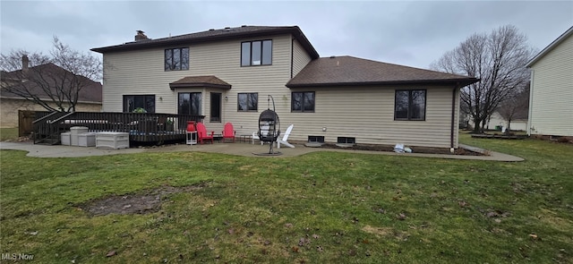 rear view of property with a chimney, a patio, a deck, and a lawn